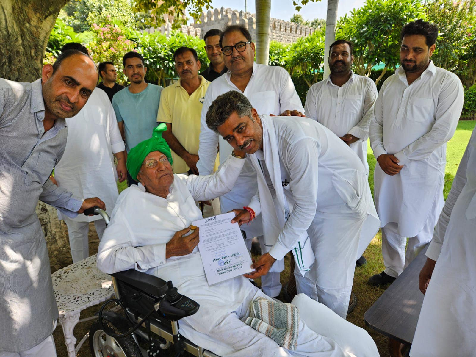 Om Prakash Chautala awards the INLD ticket to Aditya Chautala for the Dabwali constituency at Teja Khera Farm House on Sunday.